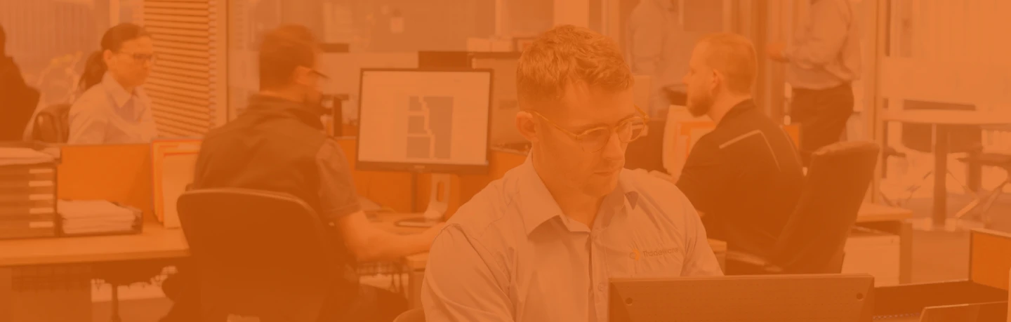 Office setting with people working on their computers